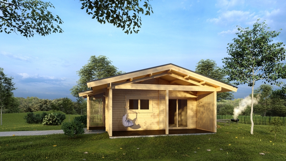 Drewniany domek na trawie.