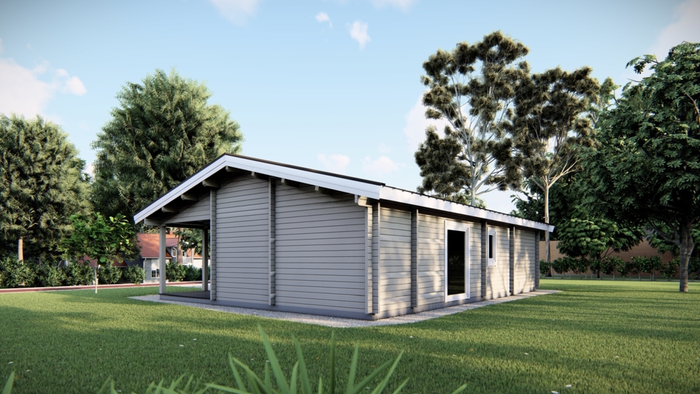 Budynek drewniany na trawie.