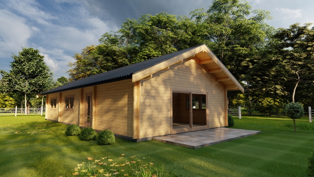 Drewniany domek na polanie wśród drzew.